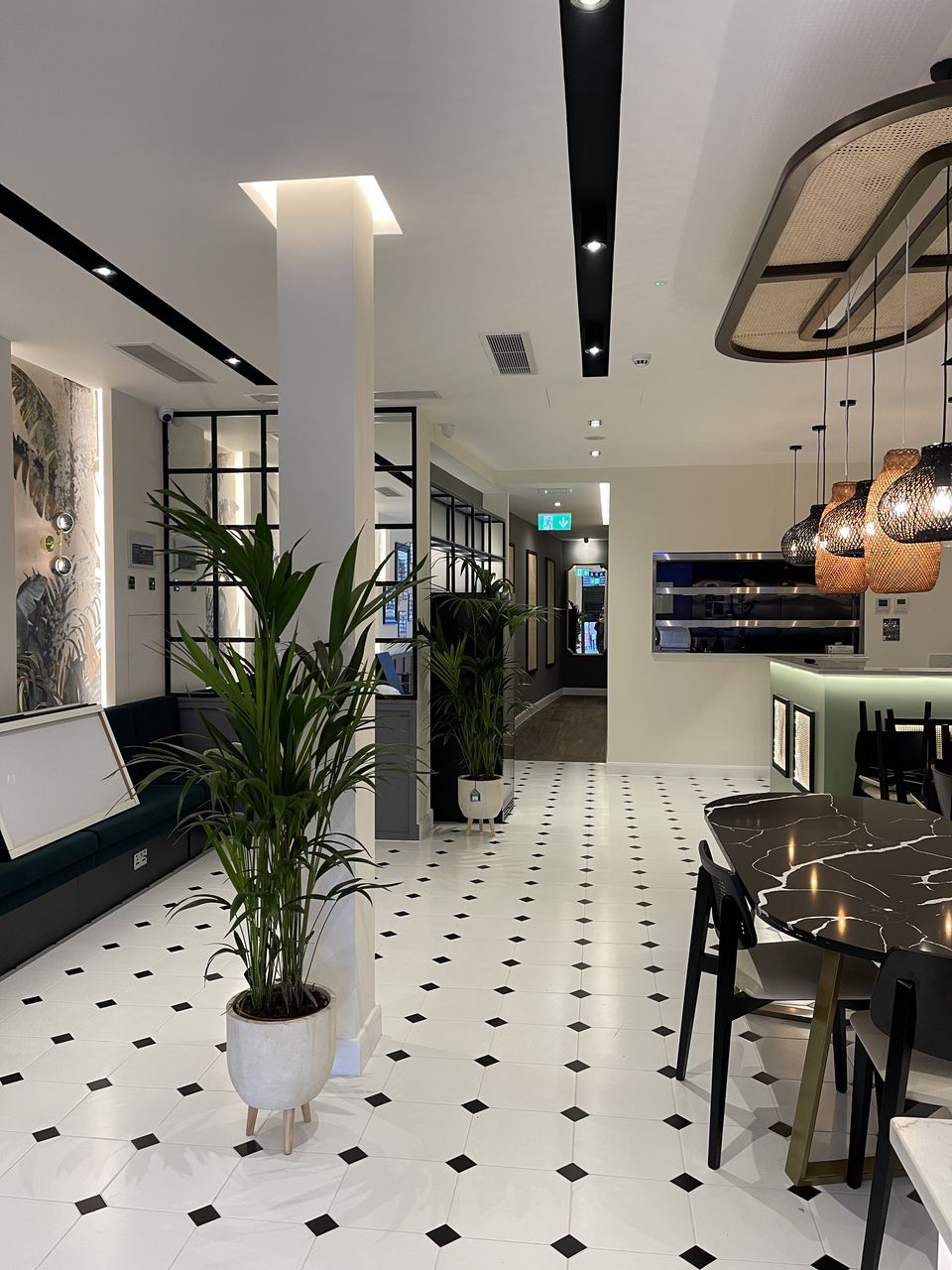 Gusto D'Italia: restaurant floor with patterned tiling and planting