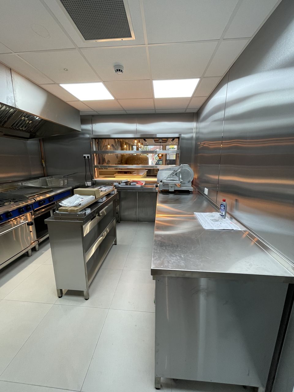 Gusto D'Italia: commercial kitchen with prep benches and wash-up