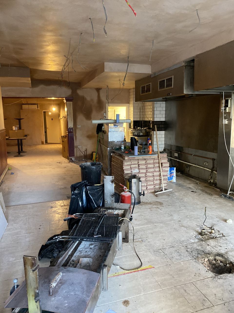 The kitchen area during fit-out, extraction and services set out.